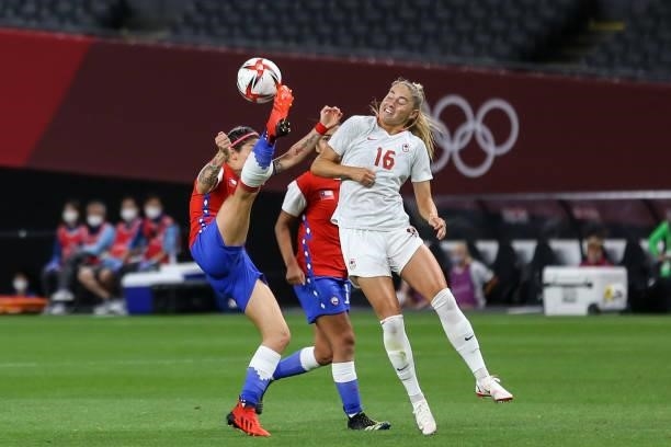 Janine BECKIE of Team Canada battles for possession with Carla GUERRERO of Team Chile during the Women's First Round Group E match between Chile and...