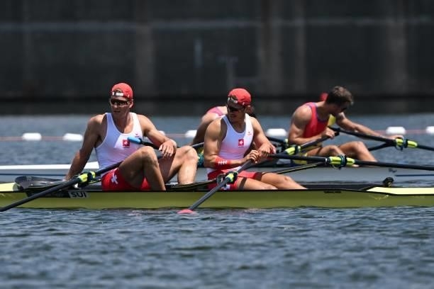 Poland's Miroslaw Zietarski and Poland's Mateusz Biskup react after the men's double sculls semi-final during the Tokyo 2020 Olympic Games at the Sea...