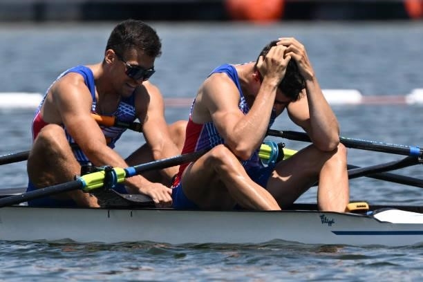 Russia's Ilya Kondratyev and Russia's Andrey Potapkin react after the men's double sculls semi-final during the Tokyo 2020 Olympic Games at the Sea...