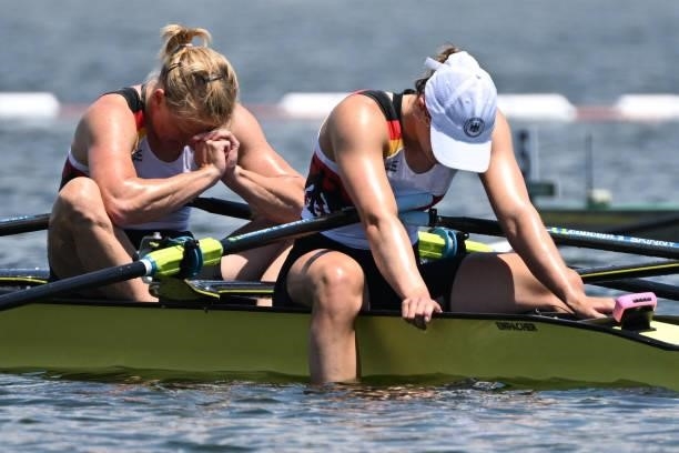 Germany's Annekatrin Thiele and Germany's Leonie Menzel react after the women's double sculls semi-final during the Tokyo 2020 Olympic Games at the...