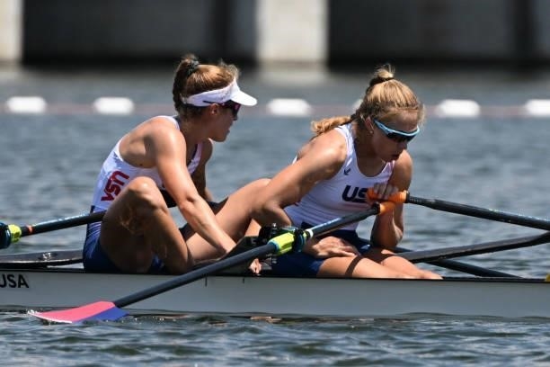 S Kristina Wagner and USA's Genevra Stone rest after the women's double sculls semi-final during the Tokyo 2020 Olympic Games at the Sea Forest...