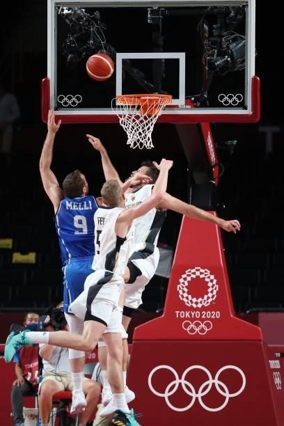 Italy's Nicolo Melli fights for the rebound in the men's preliminary round group B basketball match between Germany and Italy during the Tokyo 2020...