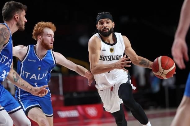 Germany's Joshiko Saibou dribbles the ball in the men's preliminary round group B basketball match between Germany and Italy during the Tokyo 2020...