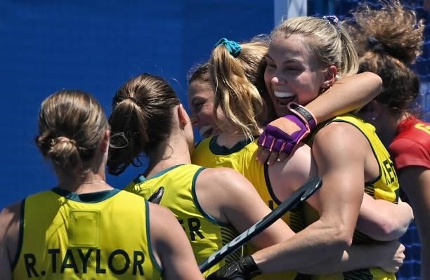 Australia's Stephanie Anna Kershaw , Ambrosia Malone and teammates celebrate after scoring against Spain during their women's pool B match of the...