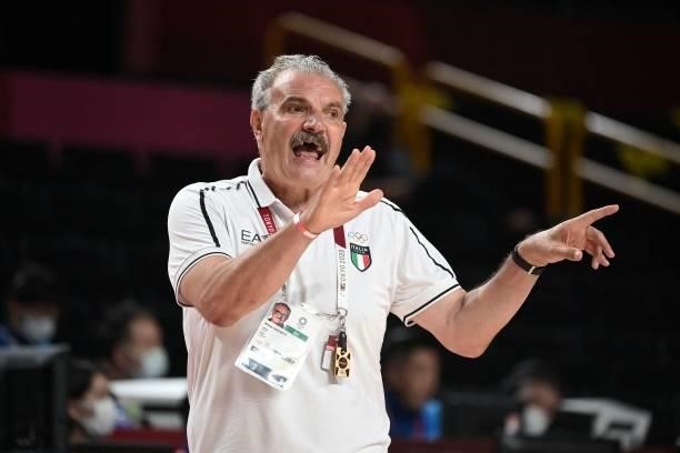 Italy's team coach Romeo Sacchetti gestures to his players in the men's preliminary round group B basketball match between Germany and Italy during...