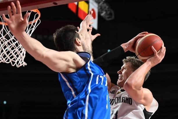 Germany's Moritz Wagner goes to the basket in the men's preliminary round group B basketball match between Germany and Italy during the Tokyo 2020...
