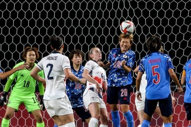 Honoka HAYASHI of Team Japan is defend with her head during the Women's First Round Group E match between Japan and Great Britain on day one of the...