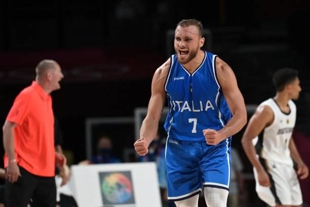 Italy's Stefano Tonut celebrates after his team's win in the men's preliminary round group B basketball match between Germany and Italy during the...