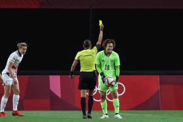 Eferee Anastasia PUSTOVOITOVA give yellow card for Ayaka YAMASHITA goalkeeper of Team Japan during the Women's First Round Group E match between...