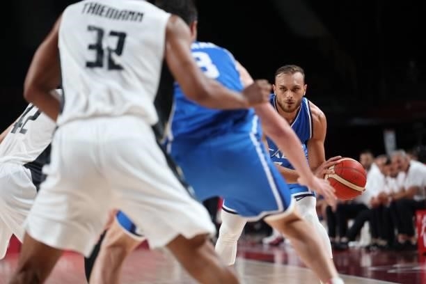 Italy's Stefano Tonut dribbles the ball in the men's preliminary round group B basketball match between Germany and Italy during the Tokyo 2020...