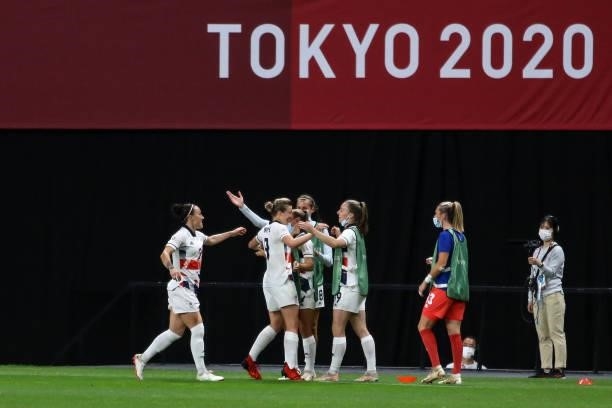 Ellen White of Team Great Britain celebrates after scoring their side's first goal with teammate during the Women's First Round Group E match between...