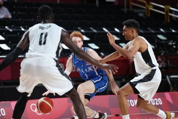 Italy's Niccolo Mannion dribbles the ball past Germany's Maodo Lo in the men's preliminary round group B basketball match between Germany and Italy...