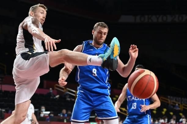 Italy's Nicolo Melli watches the ball in the men's preliminary round group B basketball match between Germany and Italy during the Tokyo 2020 Olympic...