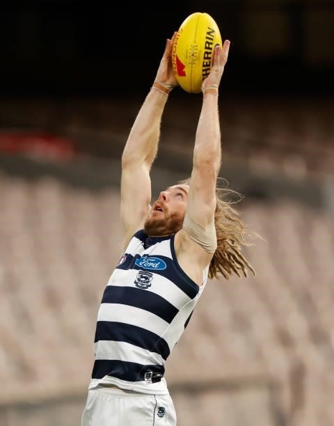 Cameron Guthrie of the Cats marks the ball during the 2021 AFL Round 19 match between the Geelong Cats and the Richmond Tigers at the Melbourne...