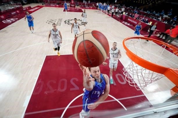 Italy's Nicolo Melli goes to the basket in the men's preliminary round group B basketball match between Germany and Italy during the Tokyo 2020...