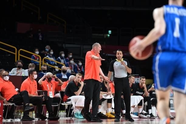 Germany's team coach Henrik Roedl gestures to the referee in the men's preliminary round group B basketball match between Germany and Italy during...