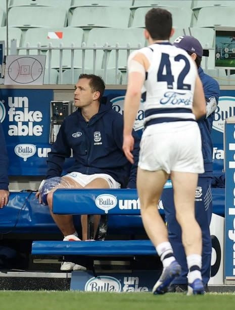 Joel Selwood of the Cats looks on from the bench after being subbed from the match during the 2021 AFL Round 19 match between the Geelong Cats and...