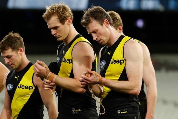 David Astbury and Dylan Grimes of the Tigers look dejected after a loss during the 2021 AFL Round 19 match between the Geelong Cats and the Richmond...