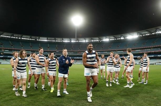Esava Ratugolea of the Cats leads the team from the field after his 50th match during the 2021 AFL Round 19 match between the Geelong Cats and the...