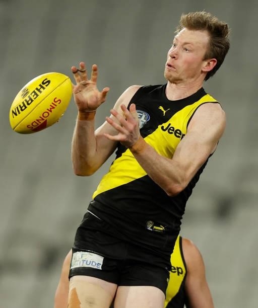 Dylan Grimes of the Tigers attempts to mark during the 2021 AFL Round 19 match between the Geelong Cats and the Richmond Tigers at the Melbourne...