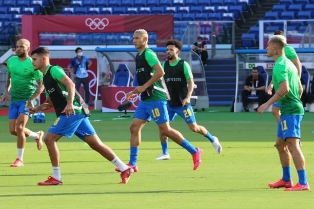 Brazil players warm up before the Tokyo 2020 Olympic Games men's group D first round football match between Brazil and Ivory Coast at the Yokohama...