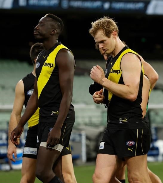 Mabior Chol and David Astbury of the Tigers look dejected after a loss during the 2021 AFL Round 19 match between the Geelong Cats and the Richmond...