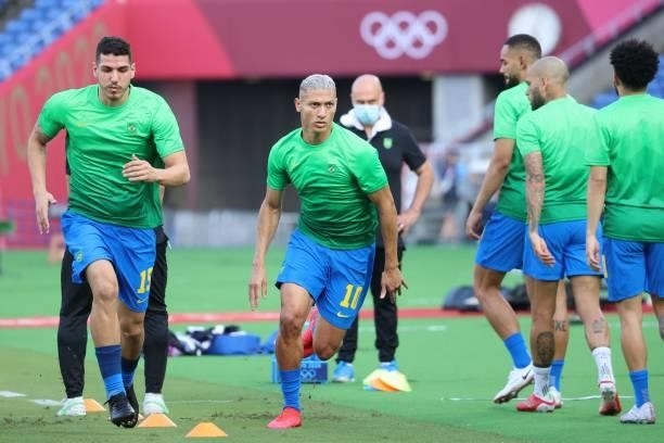 Brazil players warm up before the Tokyo 2020 Olympic Games men's group D first round football match between Brazil and Ivory Coast at the Yokohama...