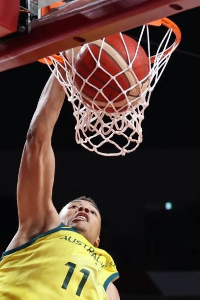 Australia's Dante Exum goes for a dunk in the men's preliminary round group B basketball match between Australia and Nigeria during the Tokyo 2020...