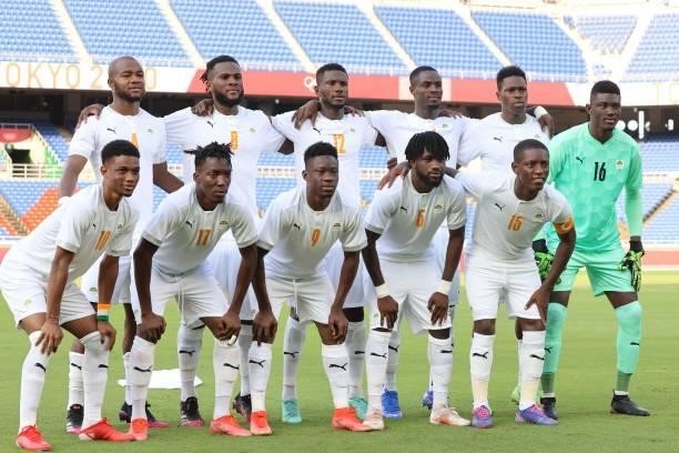Ivory Coast's players pose for a team photo before the start of the Tokyo 2020 Olympic Games men's group D first round football match between Brazil...