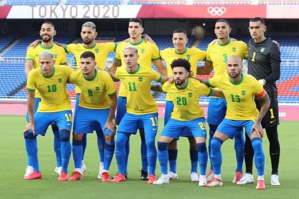Brazil players pose for a team photo before the start of the Tokyo 2020 Olympic Games men's group D first round football match between Brazil and...