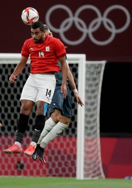 Egypt's forward Ahmed Rayan heads the ball beside Argentina's defender during the Tokyo 2020 Olympic Games men's group C first round football match...