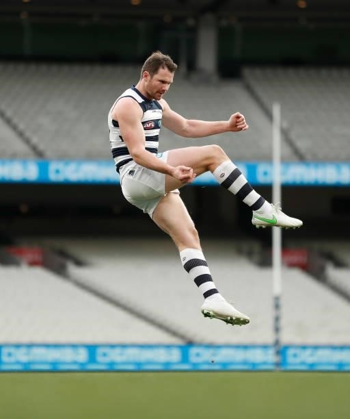 Patrick Dangerfield of the Cats kicks a goal during the 2021 AFL Round 19 match between the Geelong Cats and the Richmond Tigers at the Melbourne...