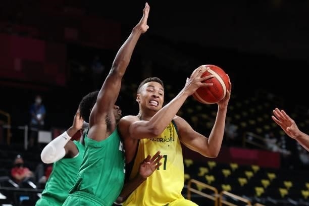 Australia's Dante Exum handles the ball in the men's preliminary round group B basketball match between Australia and Nigeria during the Tokyo 2020...