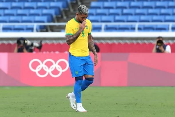 Brazil's midfielder Douglas Luiz walks off the pitch after receiving a red card during the Tokyo 2020 Olympic Games men's group D first round...