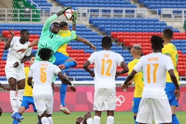 Ivory Coast's goalkeeper Eliezer Ira makes a save during the Tokyo 2020 Olympic Games men's group D first round football match between Brazil and...