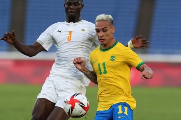 Ivory Coast's defender Eric Bailly fights for the ball with Brazil's forward Antony during the Tokyo 2020 Olympic Games men's group D first round...