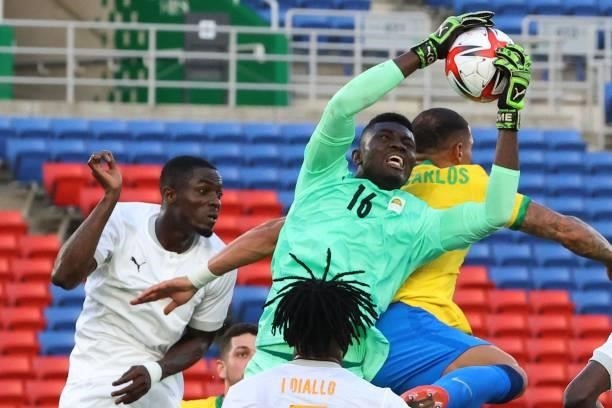 Ivory Coast's goalkeeper Eliezer Ira makes a save during the Tokyo 2020 Olympic Games men's group D first round football match between Brazil and...