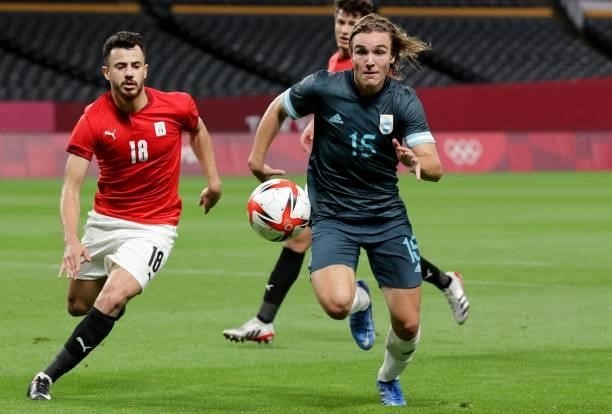Argentina's forward Pedro De La Vega chases the ball beside Egypt's defender Mahmoud El Wench during the Tokyo 2020 Olympic Games men's group C first...