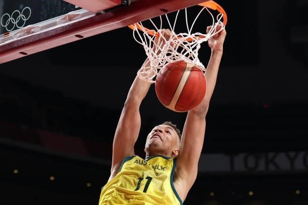 Australia's Dante Exum dunks the ball in the men's preliminary round group B basketball match between Australia and Nigeria during the Tokyo 2020...