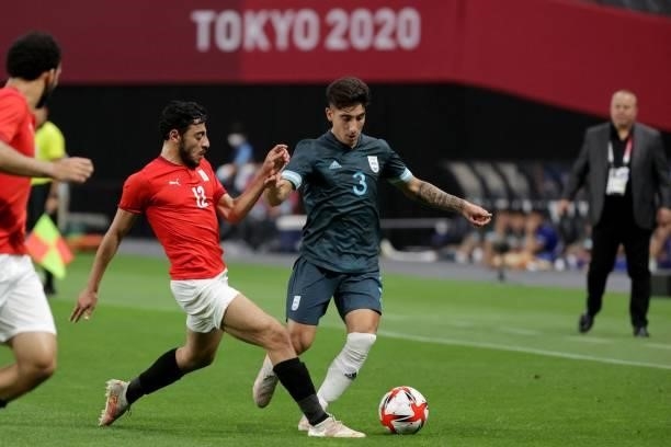 Argentina's defender Claudio Bravo fights for the ball with Egypt's midfielder Akram Tawfik during the Tokyo 2020 Olympic Games men's group C first...