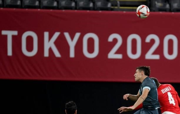 Argentina's forward Ezequiel Ponce fights for the ball with Egypt's defender Osama Galal during the Tokyo 2020 Olympic Games men's group C first...
