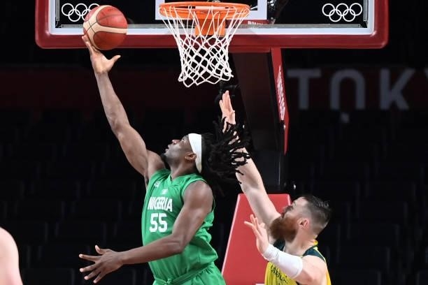 Nigeria's Precious Achiuwa goes to the basket as Australia's Aron Baynes watches in the men's preliminary round group B basketball match between...