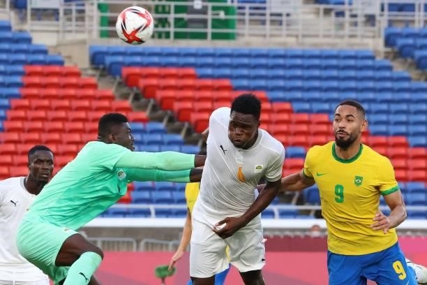 Ivory Coast's goalkeeper Eliezer Ira blocks the ball from a corner shot during the Tokyo 2020 Olympic Games men's group D first round football match...