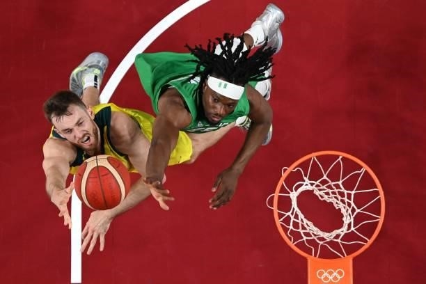 Australia's Nic Kay goes to the basket as Nigeria's Precious Achiuwa tries to block in the men's preliminary round group B basketball match between...