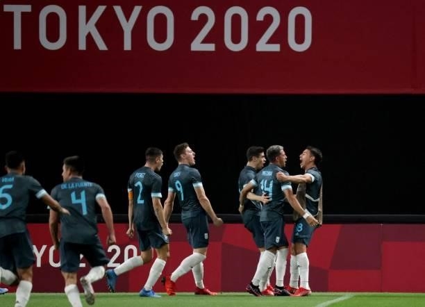 Argentina's defender Facundo Medina is celebrated his goal with teammates during the Tokyo 2020 Olympic Games men's group C first round football...