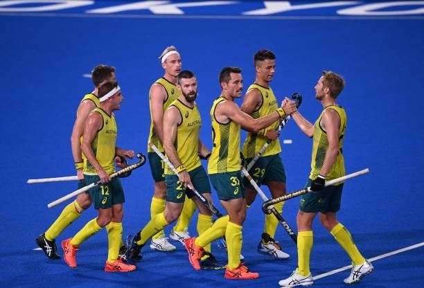 Australia's Jeremy Thomas Hayward celebrates with teammates after scoring against India during their men's pool A match of the Tokyo 2020 Olympic...