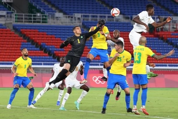 Brazil's goalkeeper Aderbar Santos punches the ball as he makes a save during the Tokyo 2020 Olympic Games men's group D first round football match...