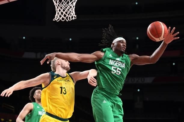 Nigeria's Precious Achiuwa handles the ball as Australia's Jock Landale watches in the men's preliminary round group B basketball match between...