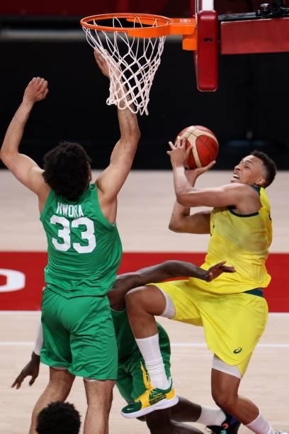 Australia's Dante Exum goes to the basket as Nigeria's Jordan Nwora tries to block in the men's preliminary round group B basketball match between...