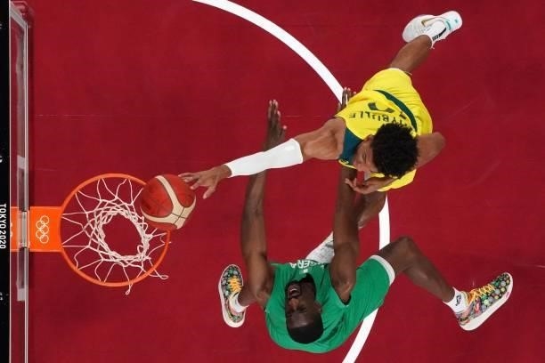 Australia's Matisse Thybulle goes to the basket as Nigeria's Ekpe Udoh reacts in the men's preliminary round group B basketball match between...